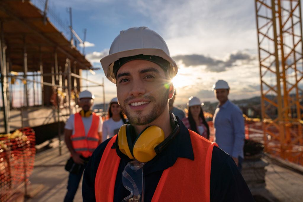 Portrait of a happy construction worker at a building site