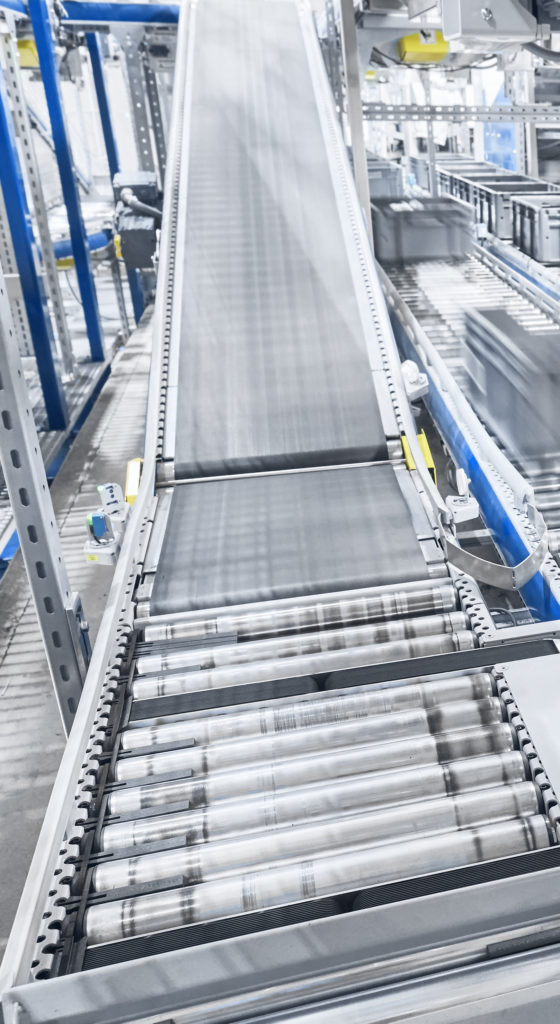 Modern conveyor system with boxes in motion.