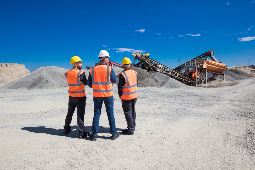 Back view of open-pit mine workers